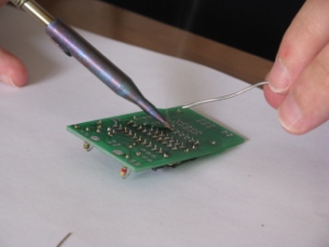 Soldering iron touching the PCB